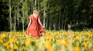 woman walking in wildflowers